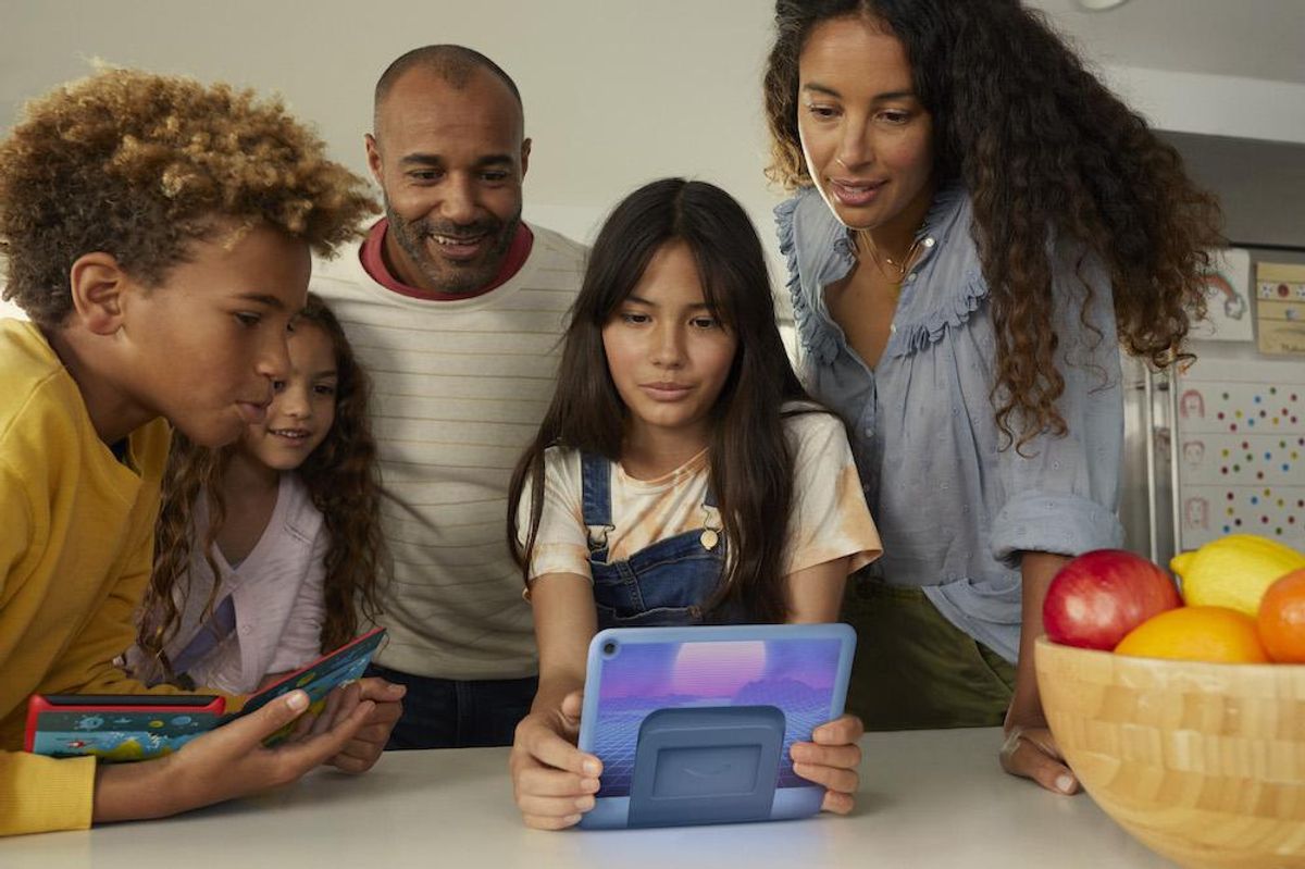 a photo of family around a new Fire HD 8 tablet pro