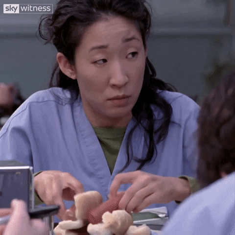 gif of woman eating two hotdogs at once.