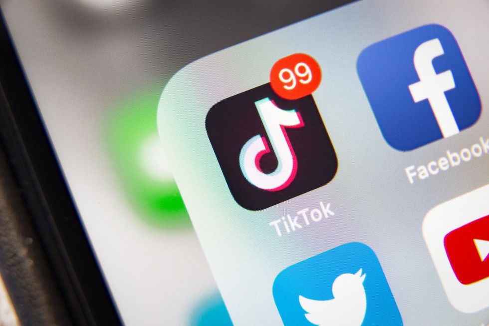 photo of smartphone showing apps like TikTok