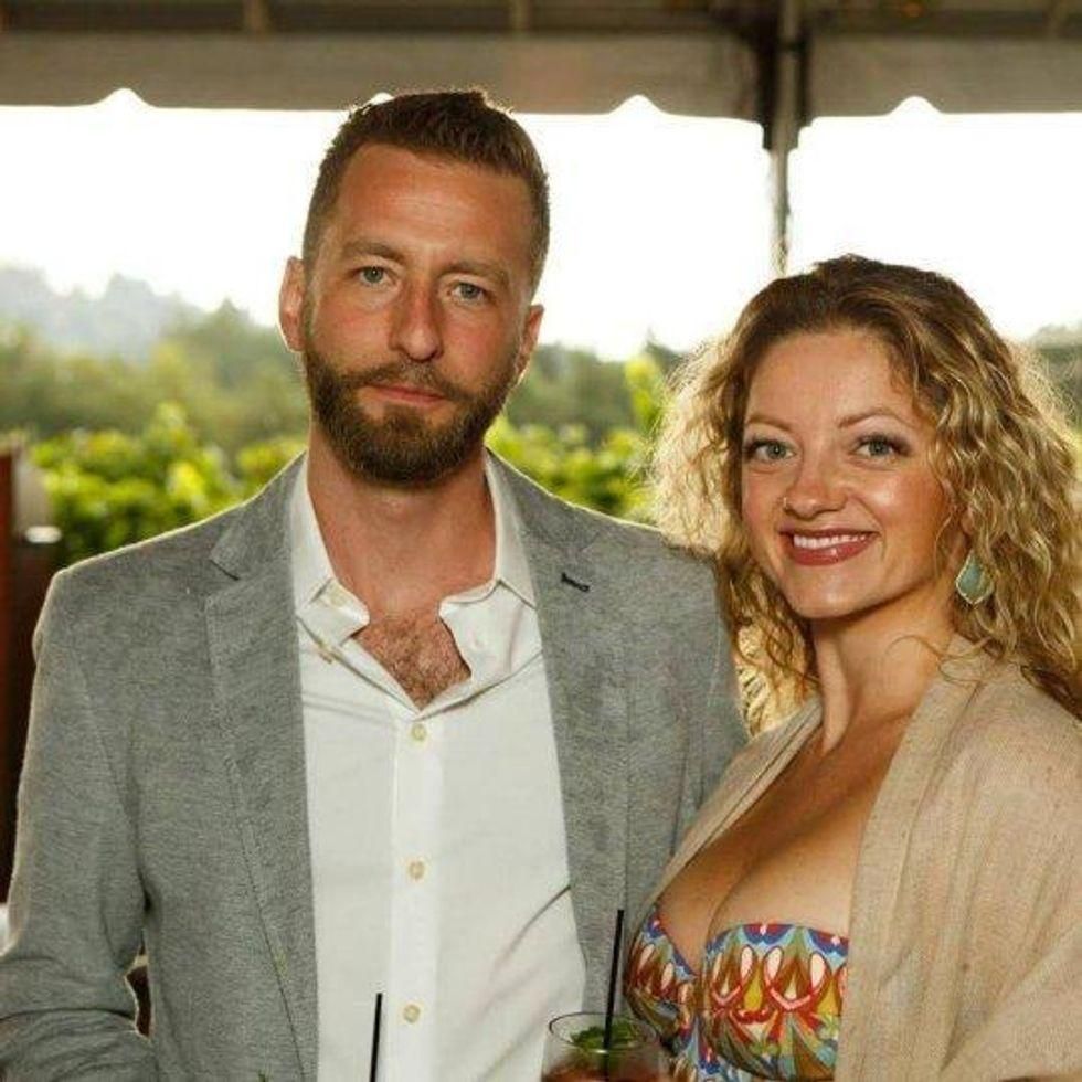 A couple smile for a photo