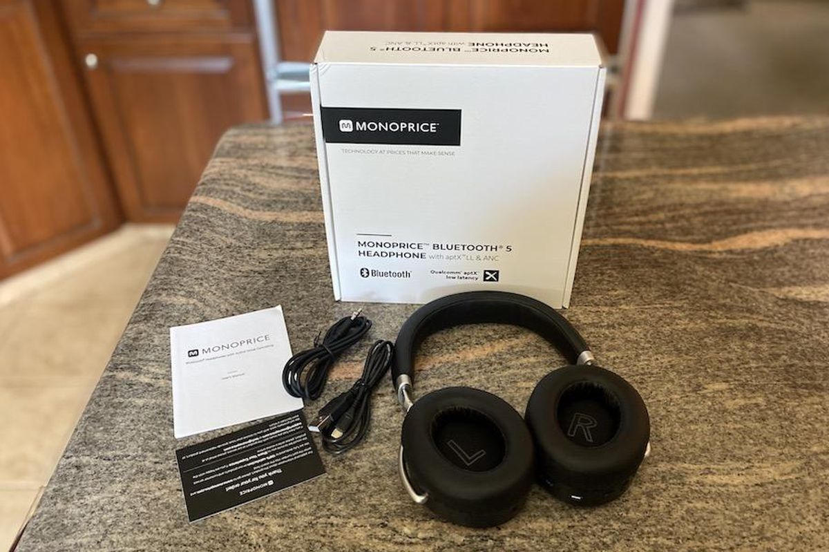 a photo of Monoprice Sync-Anc Wireless Bluetooth Headphones unboxed on a countertop