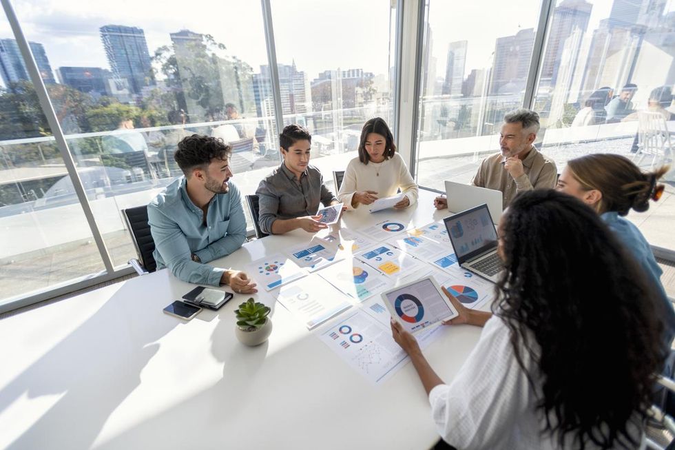 people working in a board room