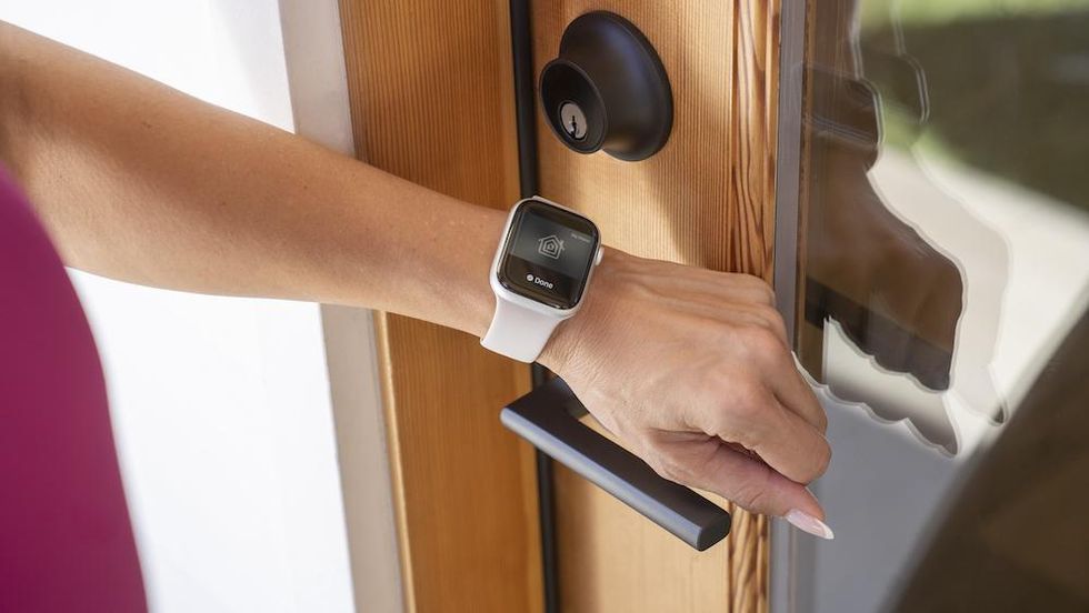 a photo of a Apple Watch unlocking Level Lock+ smart lock