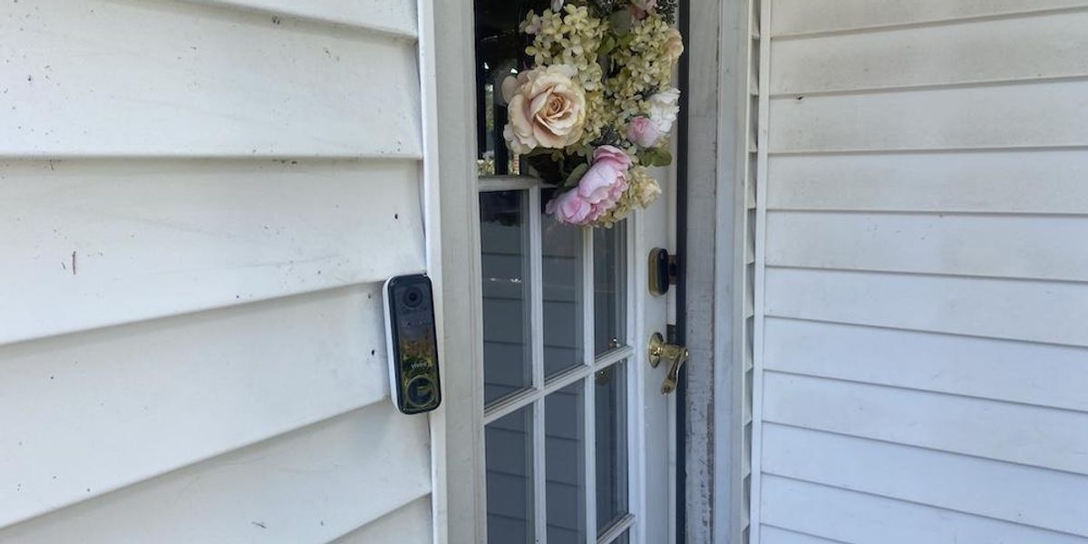 a photo of Vivint Doorbell Camera Pro (Gen 2) installed on a house next to a door