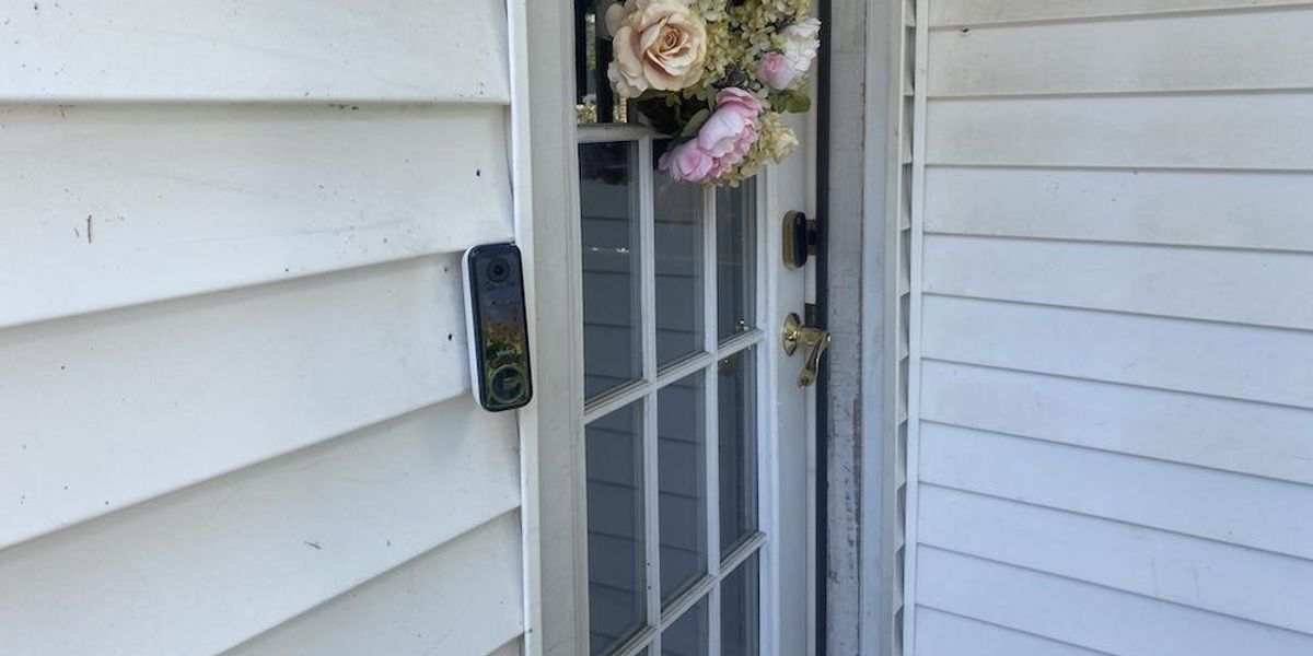 a photo of Vivint Doorbell Camera Pro (Gen 2) installed on a house next to a door