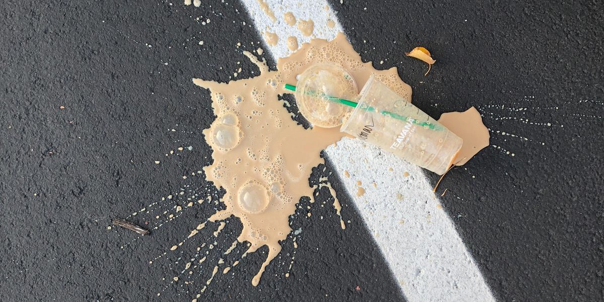 Splattered Teavana iced coffee on the pavement.
