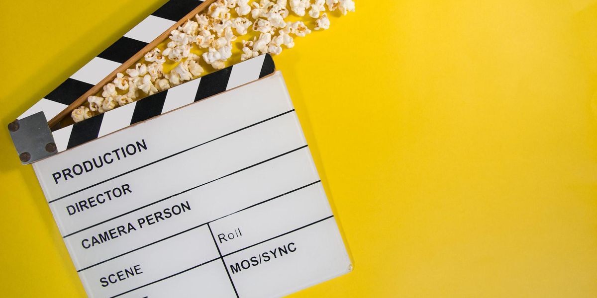picture of a movie slate crushing popcorn