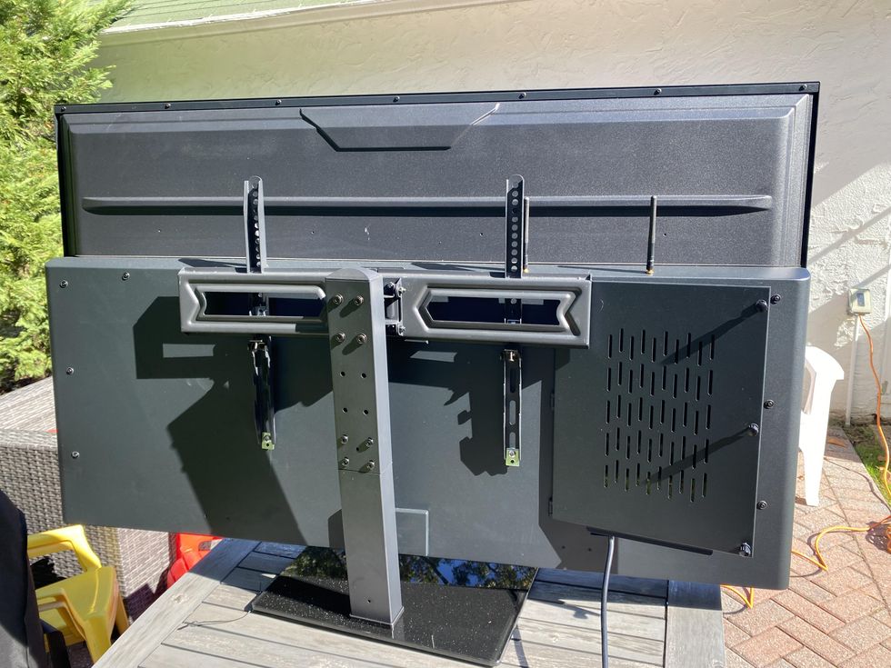 a photo of the backside of Aurora Smart Outdoor TV - 55 inch on a stand.