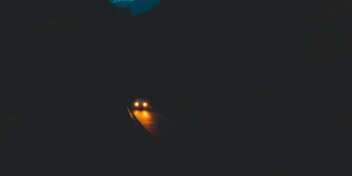 Car driving at night.