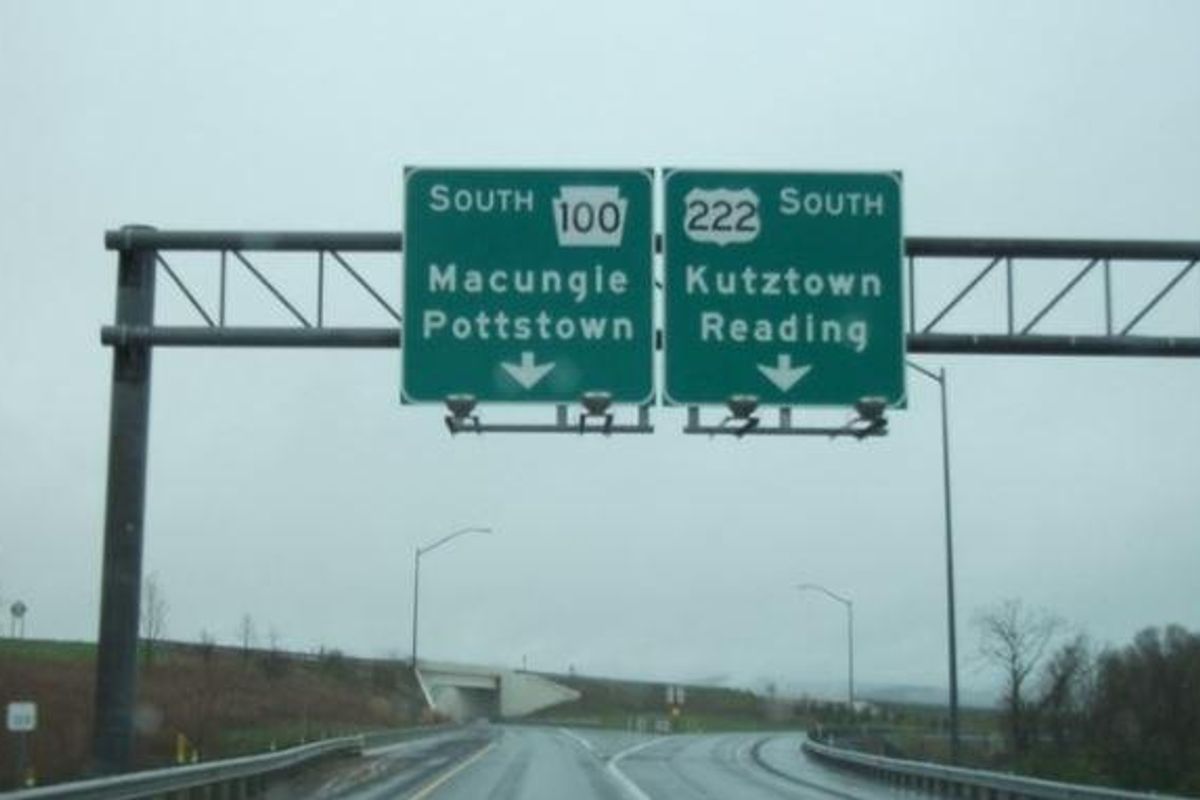 empty freeway with route signs above