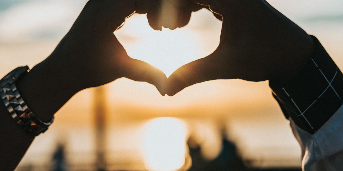 hands coming together to make a heart