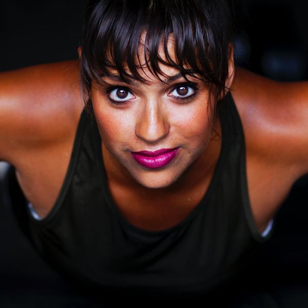women looking into camera in black tank top