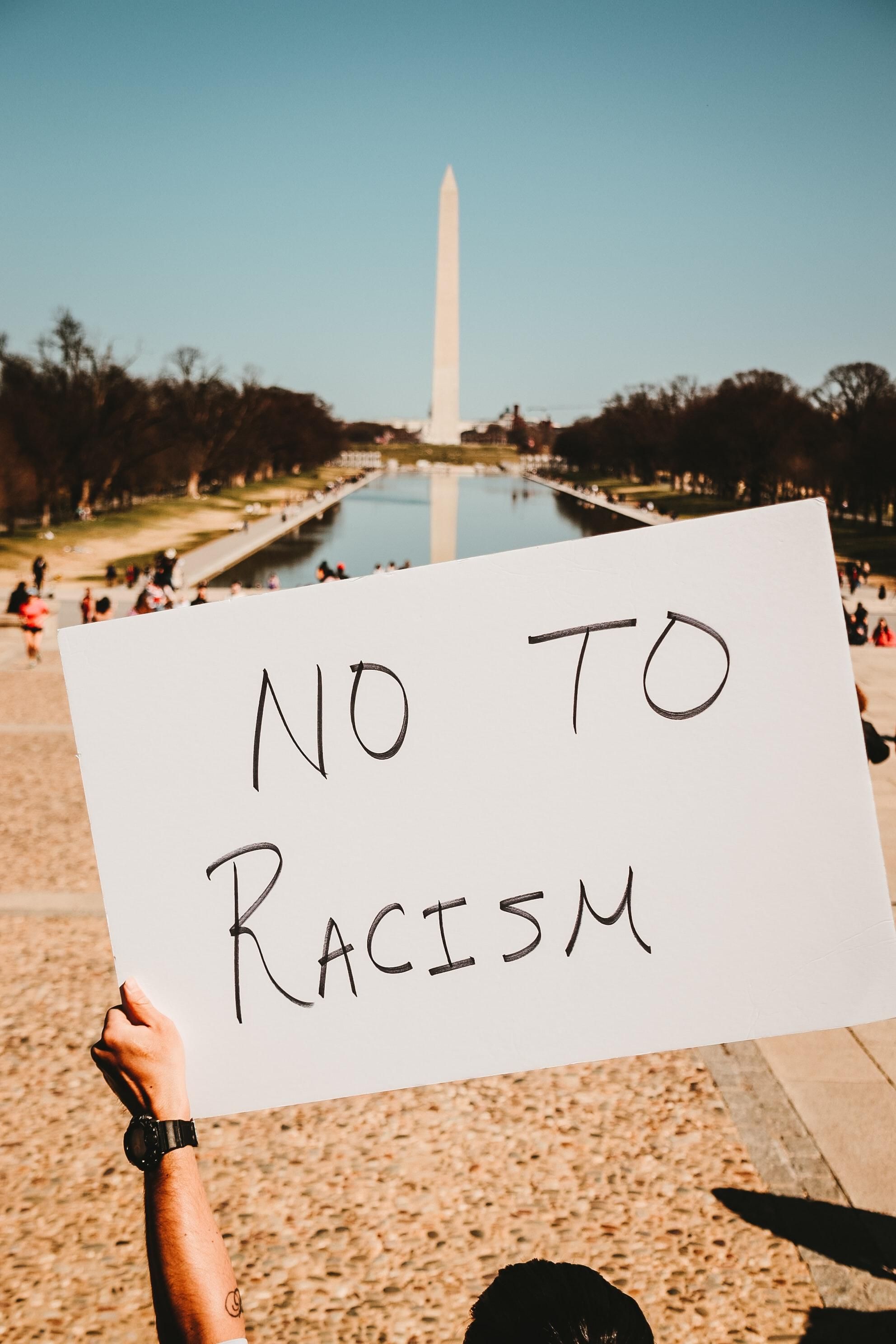 a sign that says no to racism