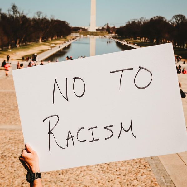 a sign that says no to racism