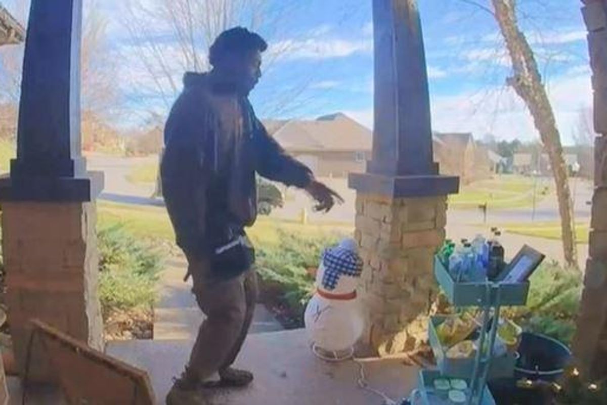 delivery man points to snacks left out for him on porch