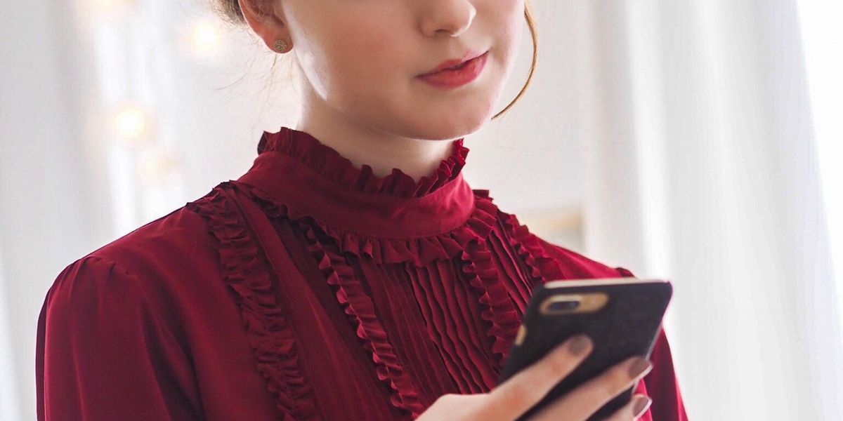 Businesswoman looking at cell phone