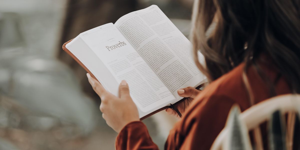 Woman looking at Bible