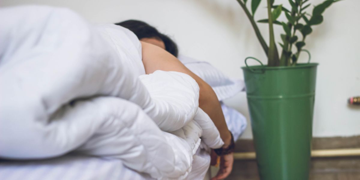 Person asleep in bed