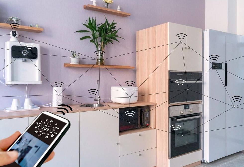 a photo of a kitchen with smart devices.
