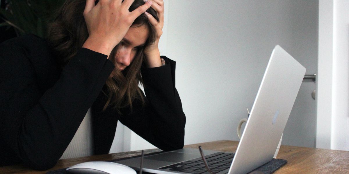Woman stressed about office work issues