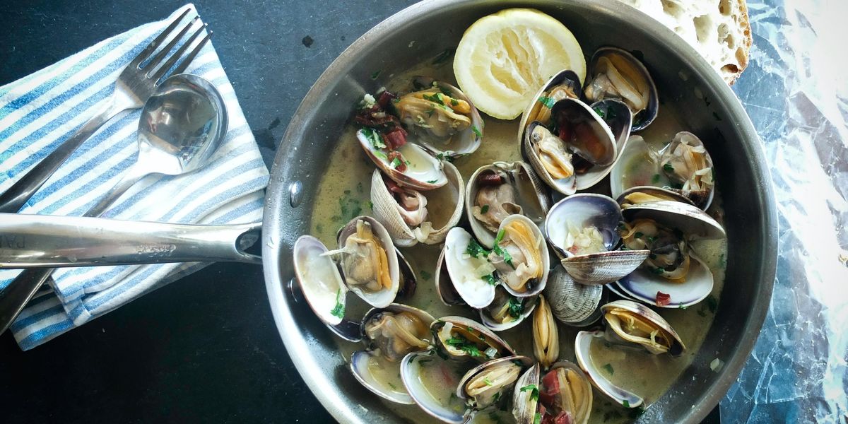 Metal bowl filled with scallops