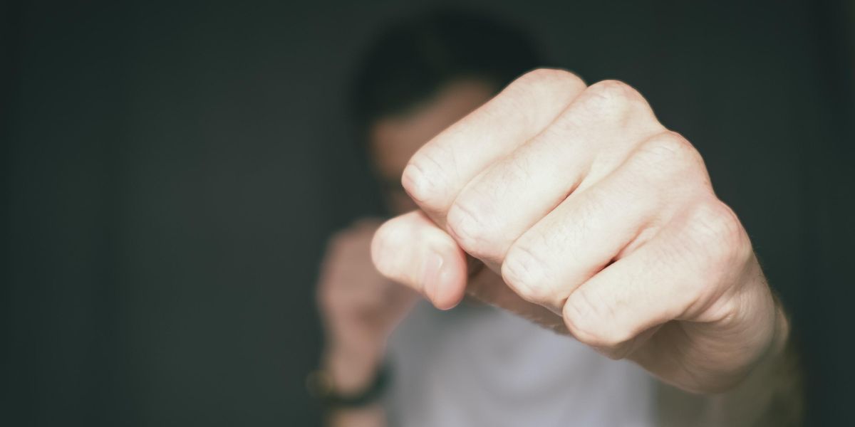 Man punching towards camera