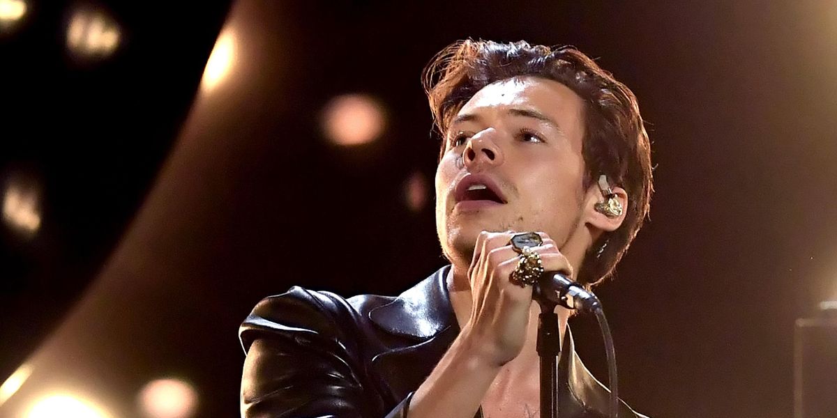 Harry Styles Rushed By Fan on Stage During Concert