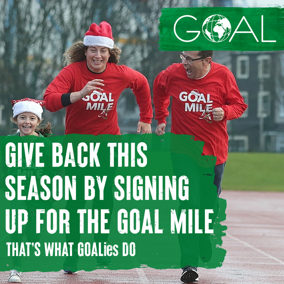 two parents and their daughter running the GOAL Mile in GOAL Mile tshirts