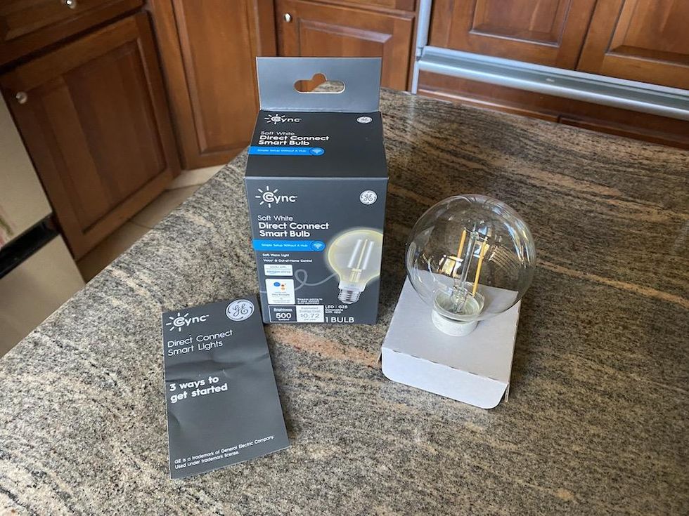 Cync Direct Connect Smart Bulb unboxed on a countertop