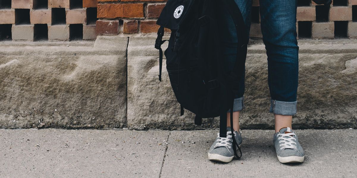 Student dangling a backpack