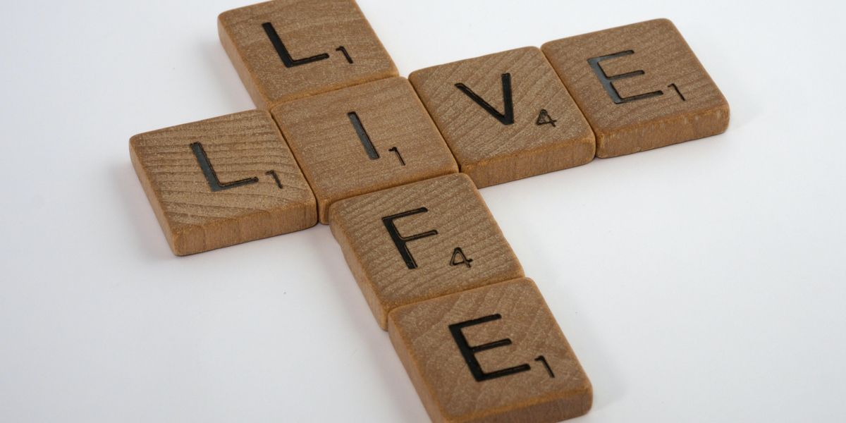 Scrabble tiles that read "Live Life"