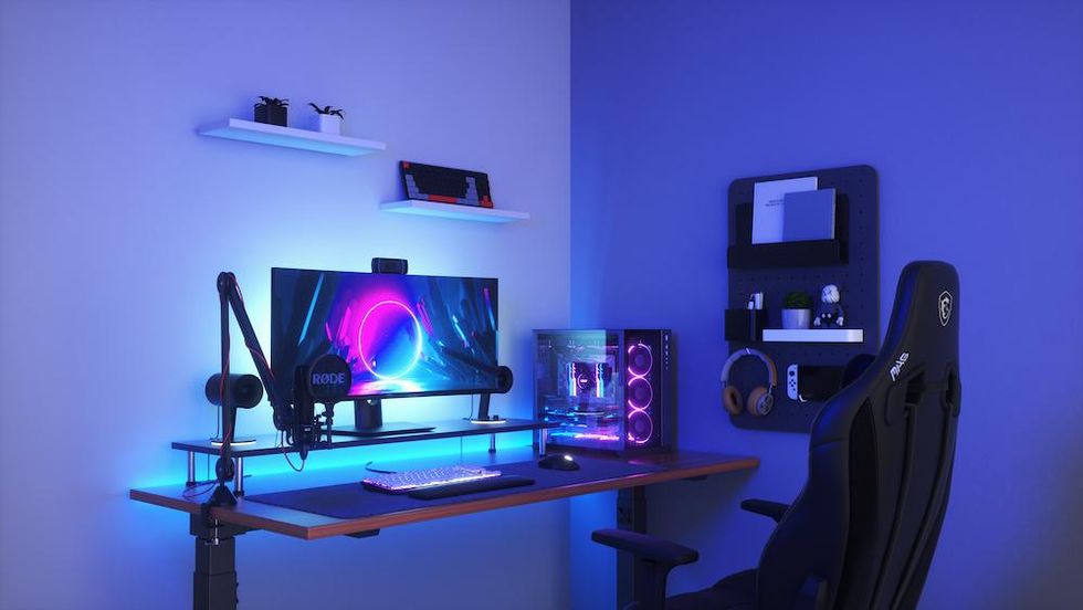 a photo of a gaming station with nanoleaf smart lightstrips