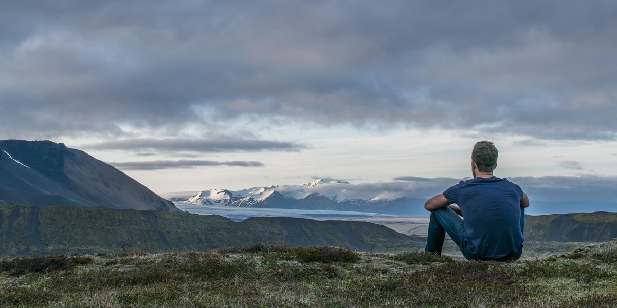 Man sitting alone out in nature