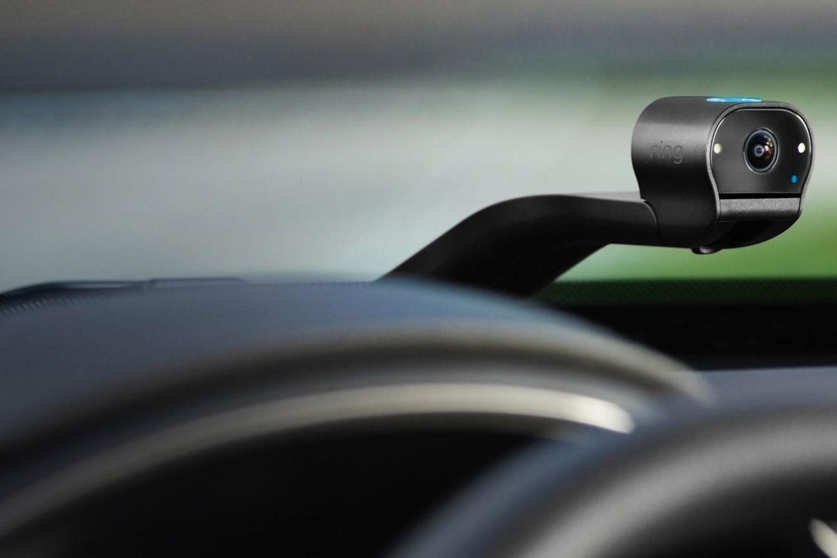 a photo of Ring Car Cam on a car's dashboard