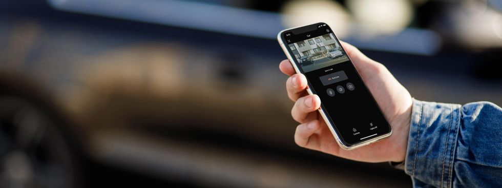 a photo of a smartphone with Ring app open