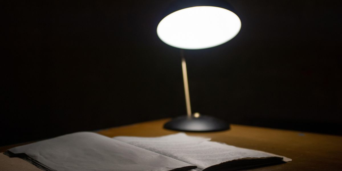 Lamp over book on desk