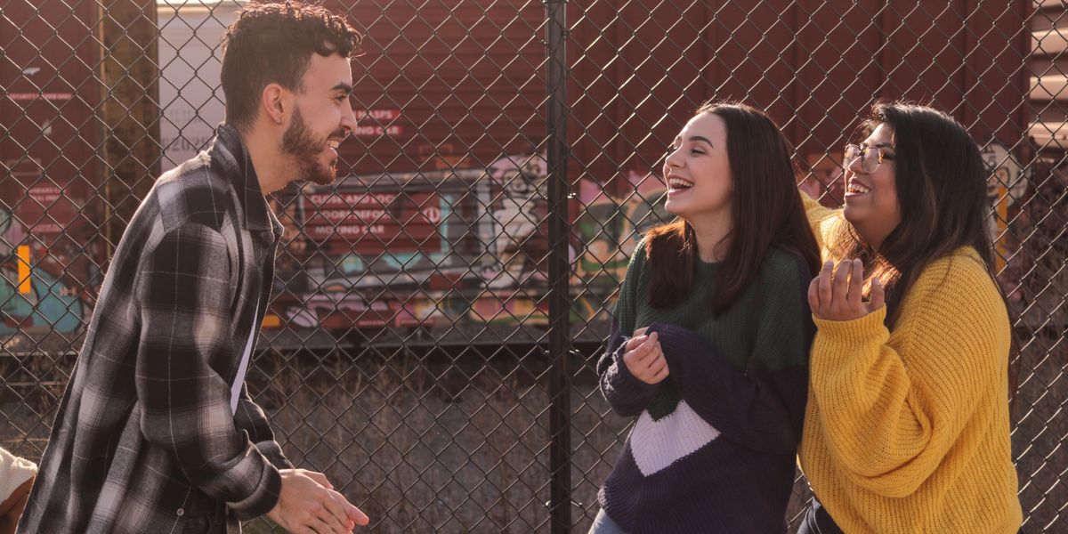 Man and two women laughing