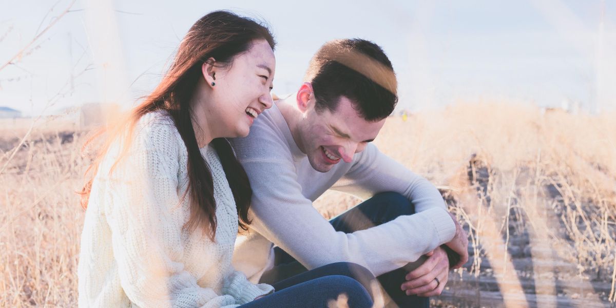 Man and woman laughing