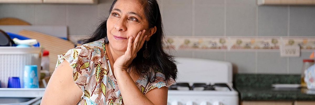 latina mom in her kitchen Latina Mom Myths: But Are They True? debunking or confirming things latina moms say