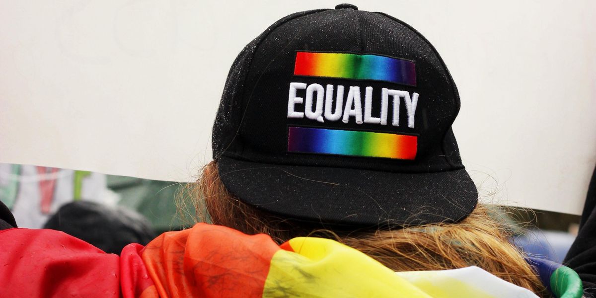 Person wearing a Pride Equality cap