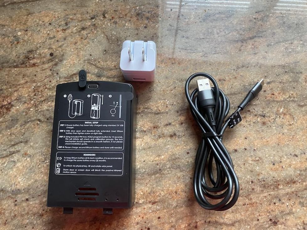 a photo of Lockly Vision Elite rechargeable battery and power cords