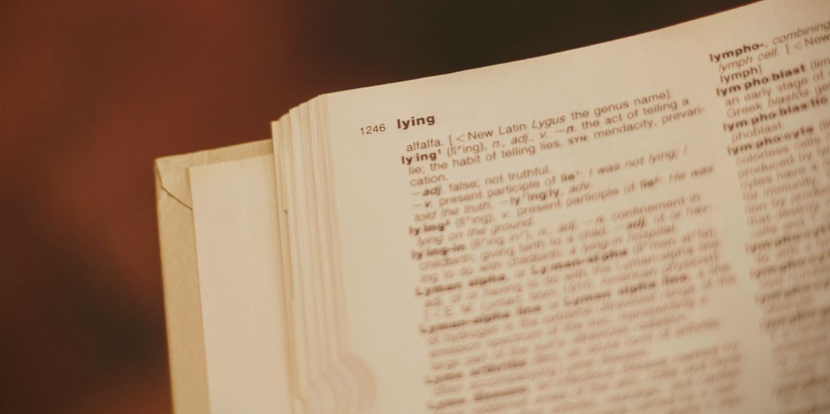 Dictionary open to the page that begins with the definition of "lying"