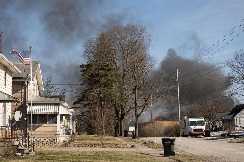 Evacuation area extended: Black smoke billows as crews release toxic chemicals from derailed tankers in Ohio Evacuation area extended: Black smoke billows as crews release toxic chemicals from derailed tankers in Ohio