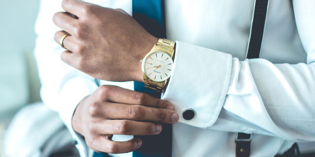 Man wearing white dress shirt and luxury watch