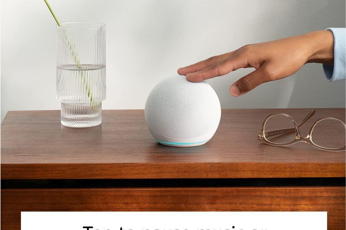 a photo of amazon echo dot 5th gen on an nightstand