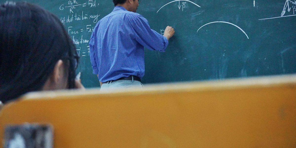 Teacher at a chalkboard