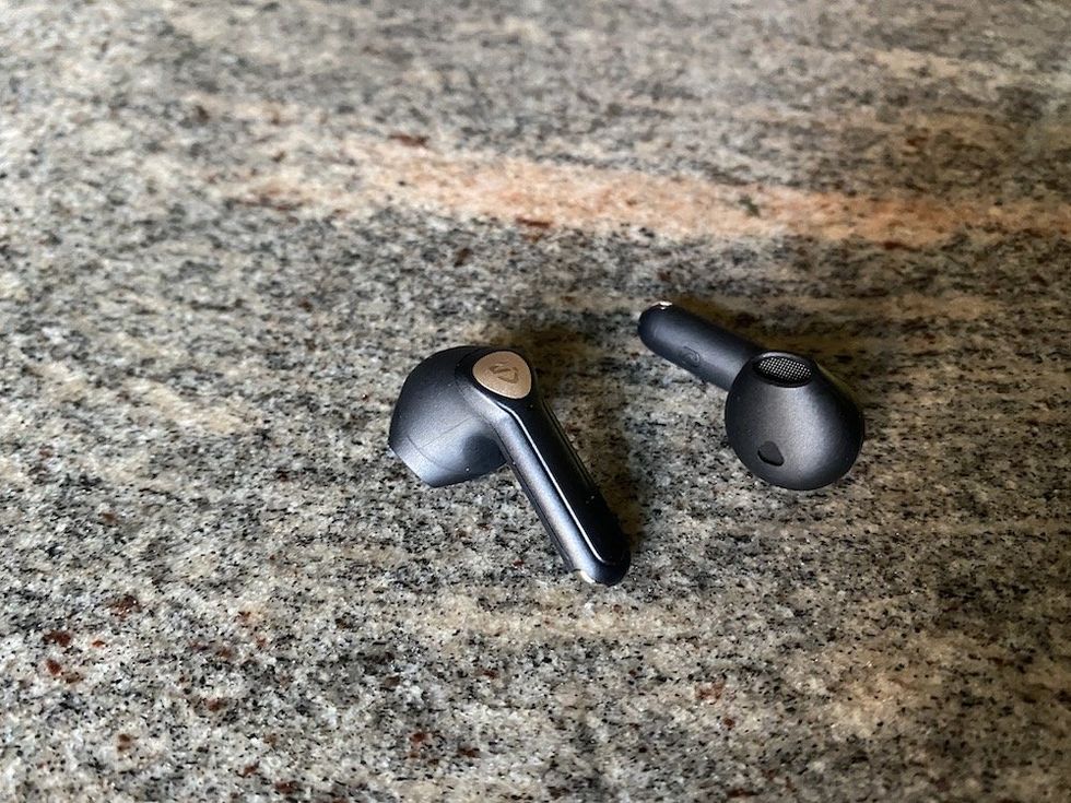 Photo of Soundpeats Air3 Deluxe HS wireless earbuds on a countertop