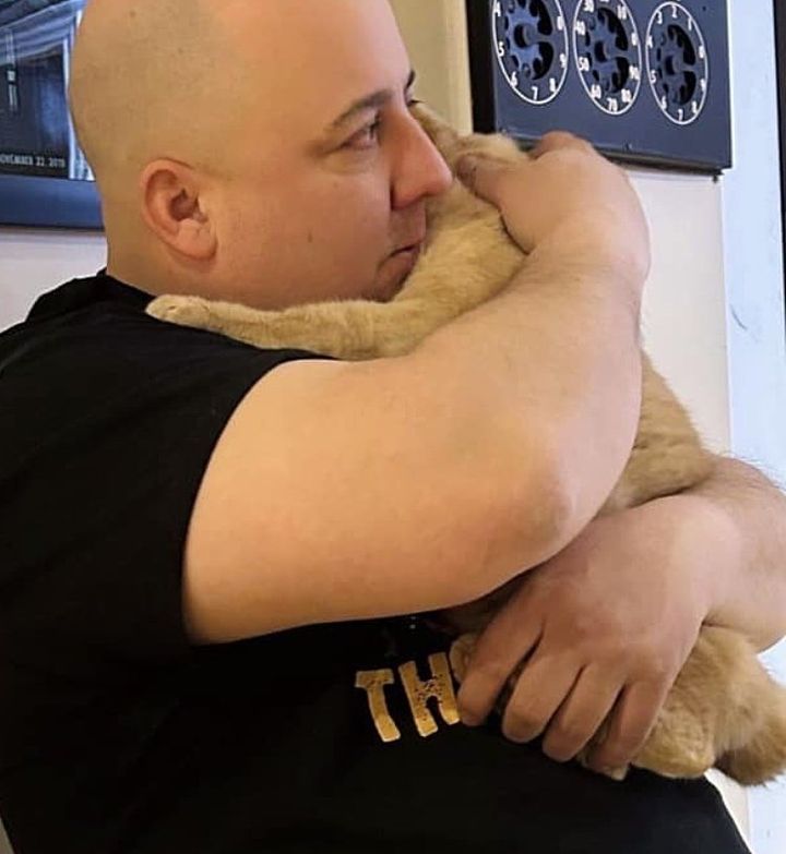 cat man hugs