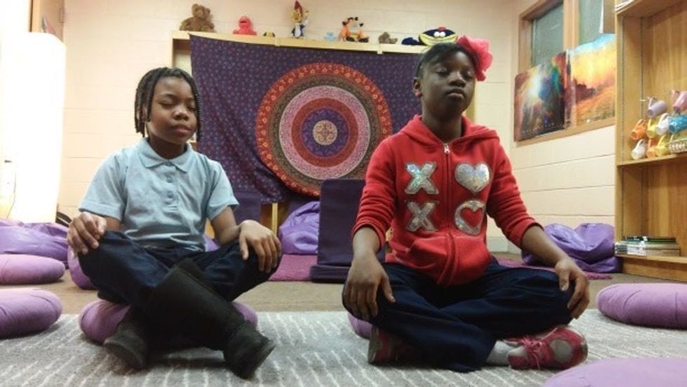 Two young people meditating
