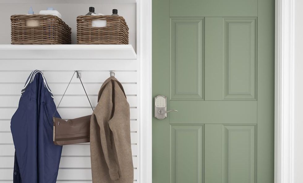 a photo of a schlage encode smart wi-fi lever lock on a door to a garage
